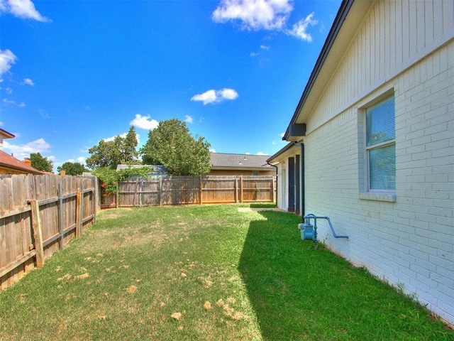 view of yard featuring a fenced backyard