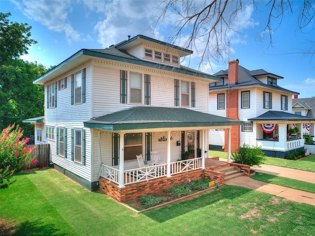 view of front of house featuring a porch and a front yard