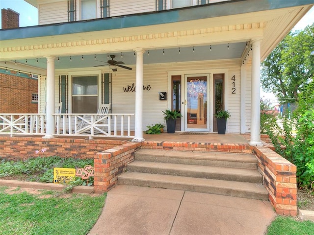 doorway to property featuring covered porch and ceiling fan