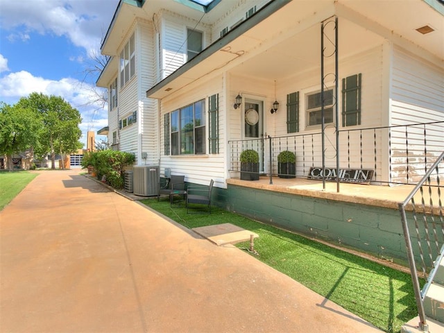 property entrance featuring central AC unit