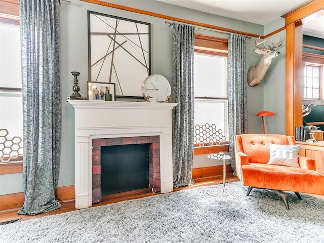 living area with hardwood / wood-style floors