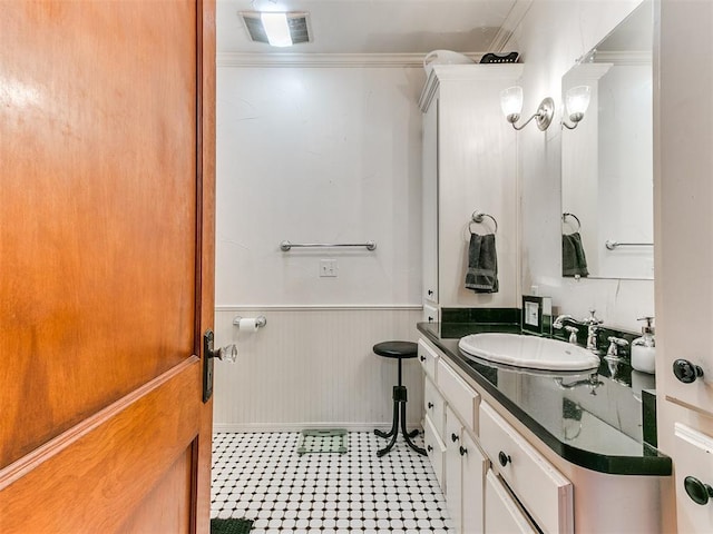 bathroom featuring vanity and crown molding