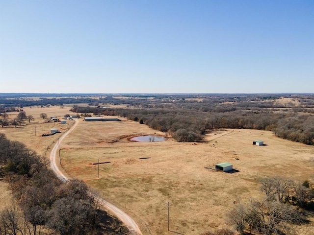 birds eye view of property with a rural view