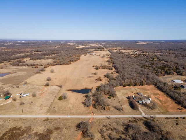 birds eye view of property with a rural view