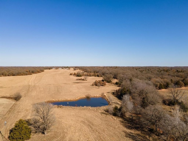 aerial view with a rural view and a water view