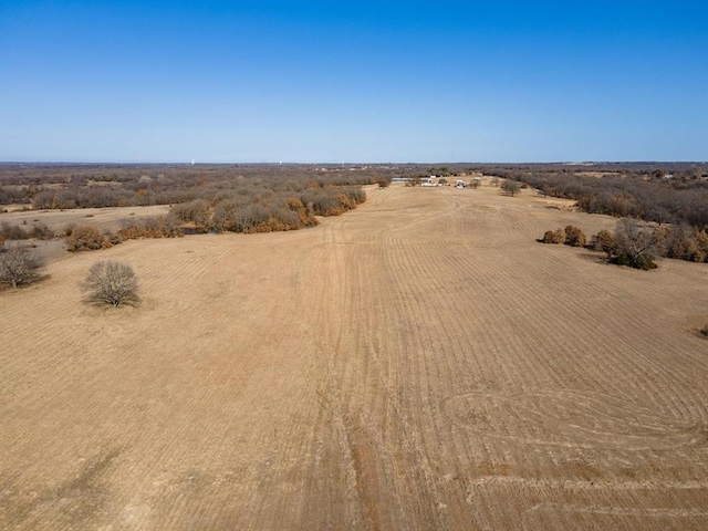 birds eye view of property with a rural view