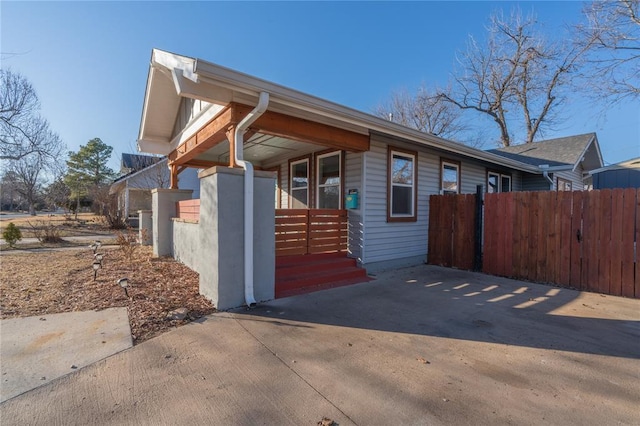 view of property exterior featuring fence