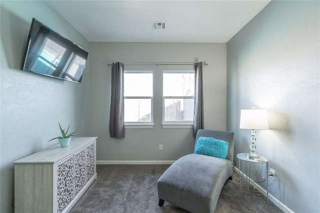 sitting room featuring carpet floors, baseboards, and visible vents