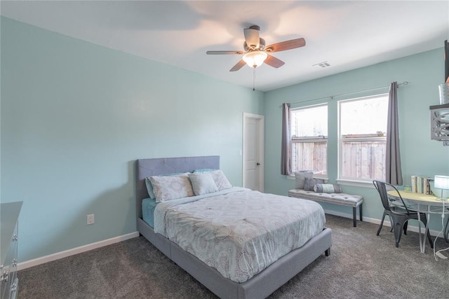 carpeted bedroom with a ceiling fan, visible vents, and baseboards