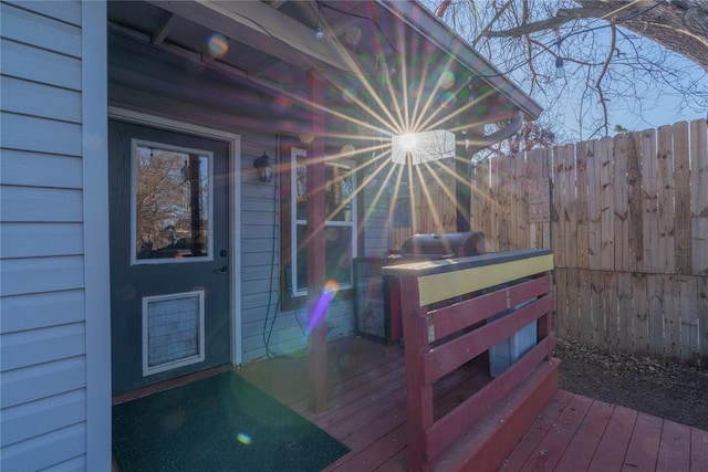 wooden terrace featuring fence and grilling area