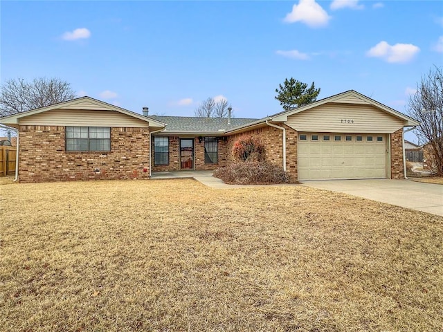 single story home featuring a garage and a front lawn