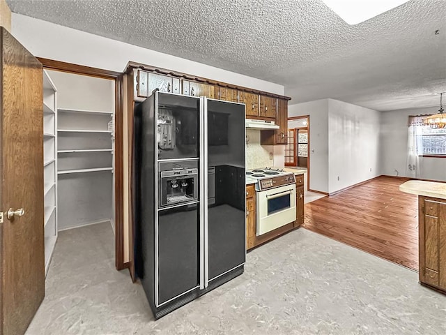 kitchen with black fridge with ice dispenser, a textured ceiling, and white range with electric stovetop