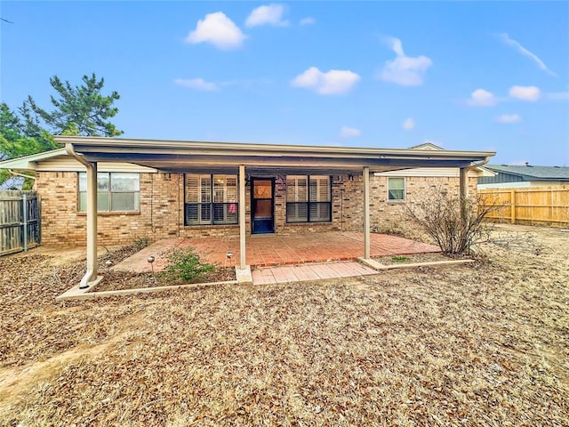 rear view of house with a patio