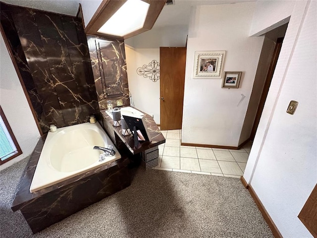 bathroom featuring tiled tub and tile patterned floors