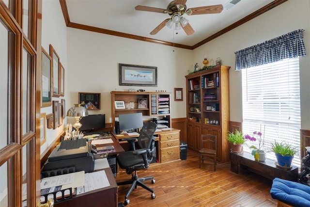 home office featuring crown molding, light hardwood / wood-style floors, and ceiling fan