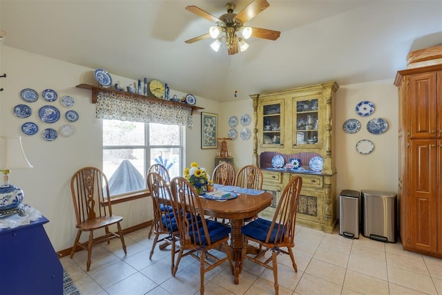 tiled dining space featuring ceiling fan