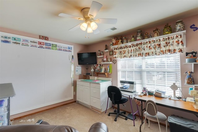 office with light colored carpet and ceiling fan