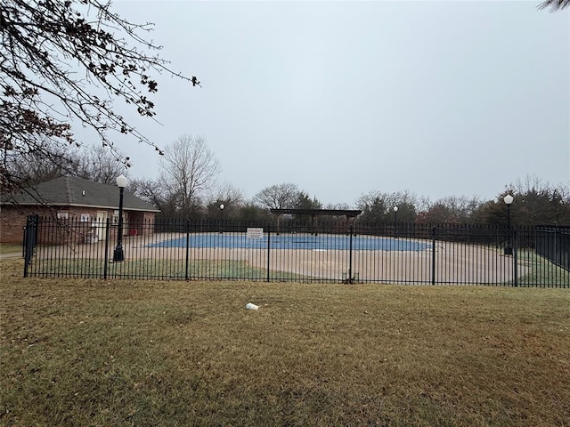 view of yard featuring a community pool