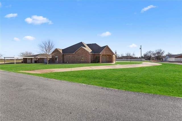 ranch-style house with a front lawn