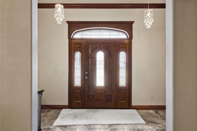 entrance foyer with a notable chandelier