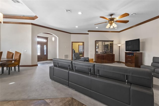 living room featuring ornamental molding and ceiling fan