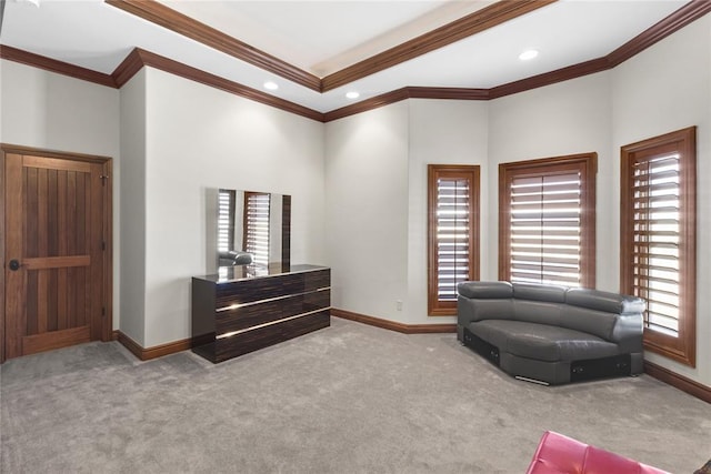 living area with crown molding and light carpet