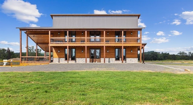 exterior space featuring a wooden deck and a front lawn