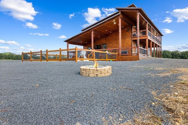 exterior space featuring an outdoor fire pit