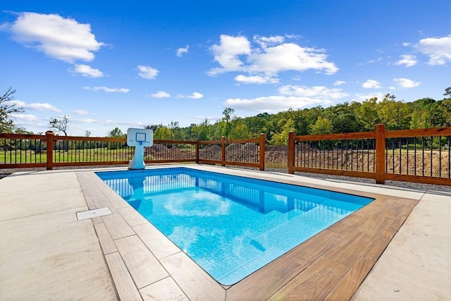 view of swimming pool featuring a patio