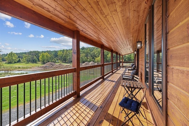 wooden deck featuring a water view