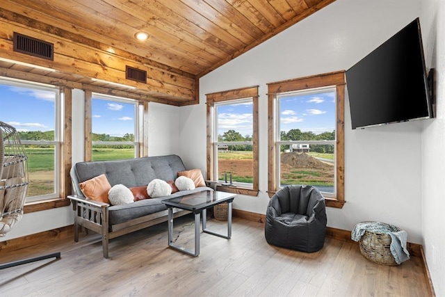 sunroom featuring wood ceiling and vaulted ceiling