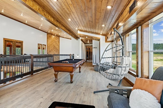 recreation room with wood ceiling, wood-type flooring, and a healthy amount of sunlight