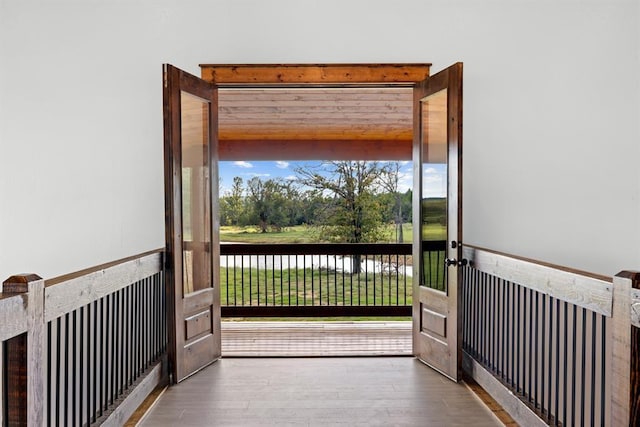 doorway with wood-type flooring