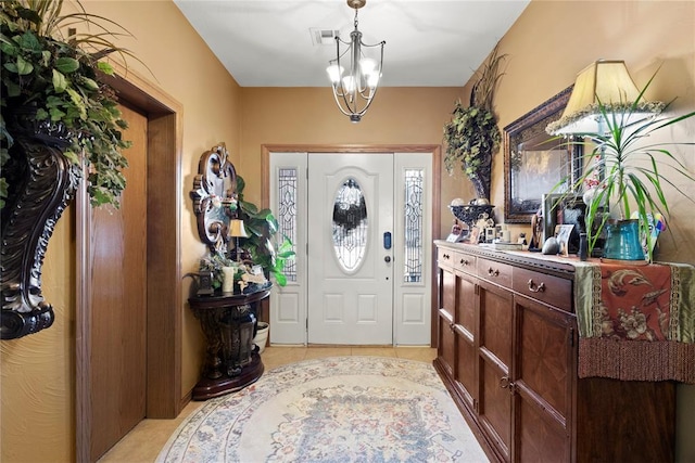 entrance foyer featuring a chandelier and visible vents