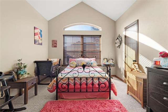 bedroom featuring lofted ceiling, baseboards, and carpet floors