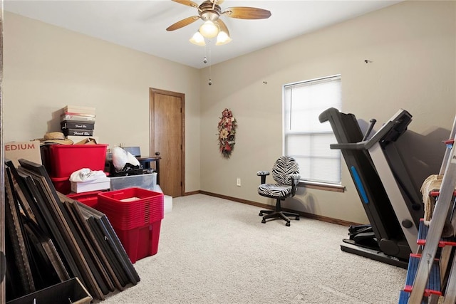 workout area featuring ceiling fan, carpet, and baseboards