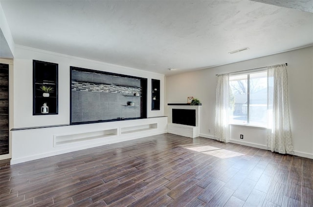 unfurnished living room with hardwood / wood-style flooring