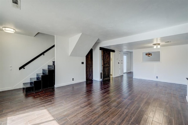 unfurnished living room with dark hardwood / wood-style floors