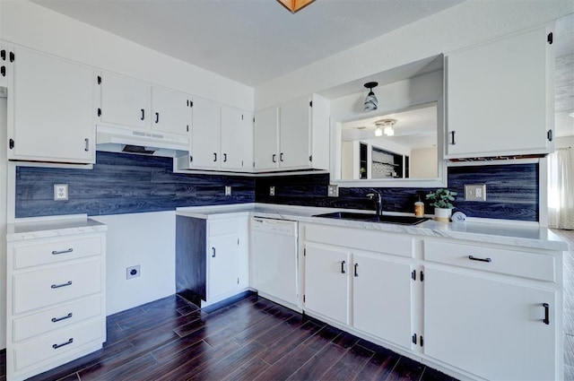 kitchen featuring sink, dark wood-type flooring, white cabinetry, white dishwasher, and decorative backsplash