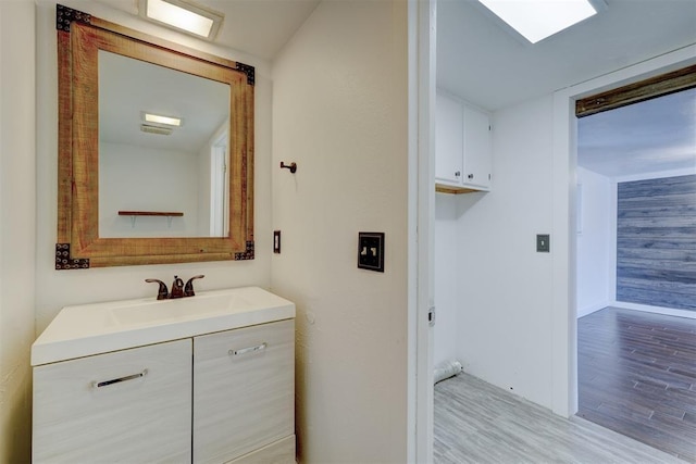 bathroom featuring wood-type flooring and vanity