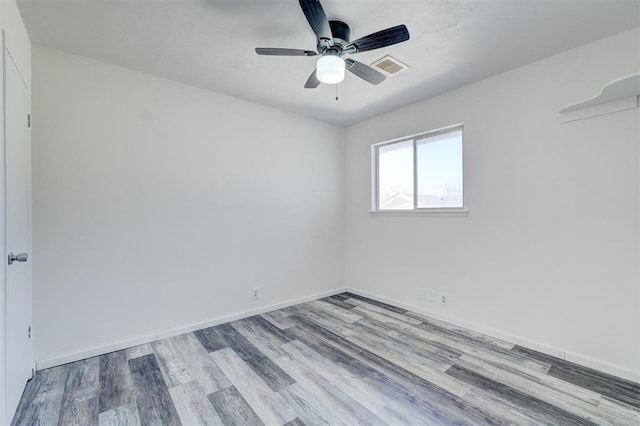 unfurnished room featuring ceiling fan and light wood-type flooring