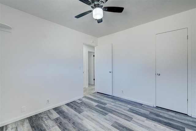 unfurnished bedroom with light hardwood / wood-style flooring and ceiling fan