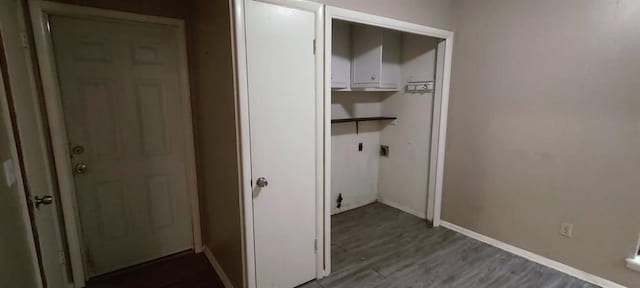 laundry area featuring hardwood / wood-style floors