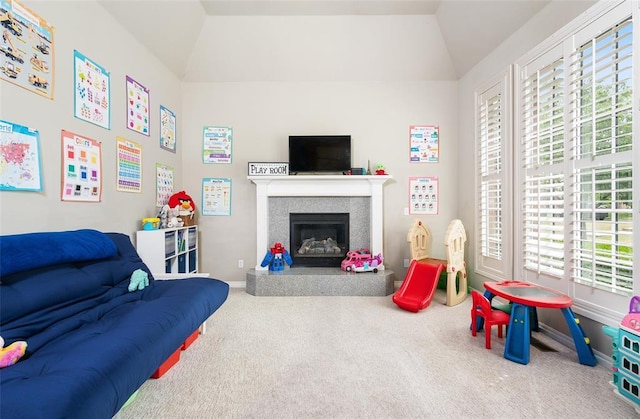 playroom featuring lofted ceiling and carpet