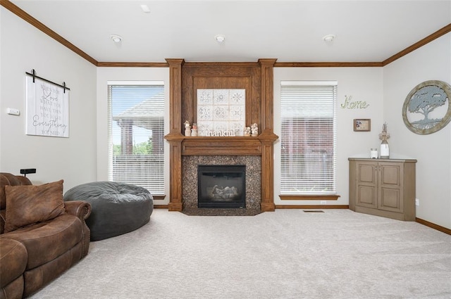 carpeted living room with crown molding and a fireplace