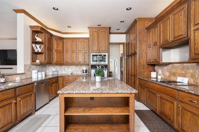 kitchen with light tile patterned floors, backsplash, a kitchen island, stainless steel appliances, and stone countertops