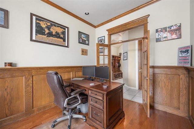 office area featuring ornamental molding and light hardwood / wood-style flooring