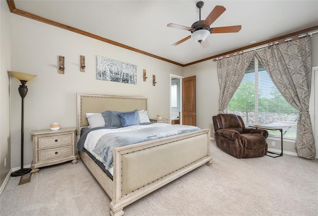 bedroom with ornamental molding, light colored carpet, and ceiling fan