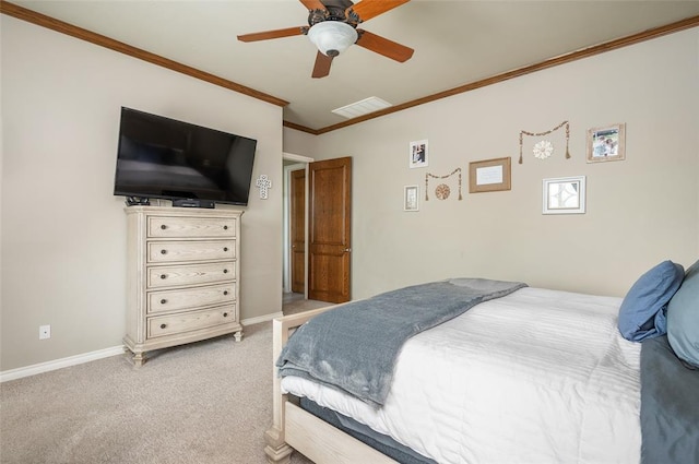 carpeted bedroom with crown molding and ceiling fan