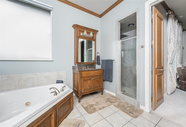 bathroom featuring tile patterned flooring, ornamental molding, shower with separate bathtub, and vanity